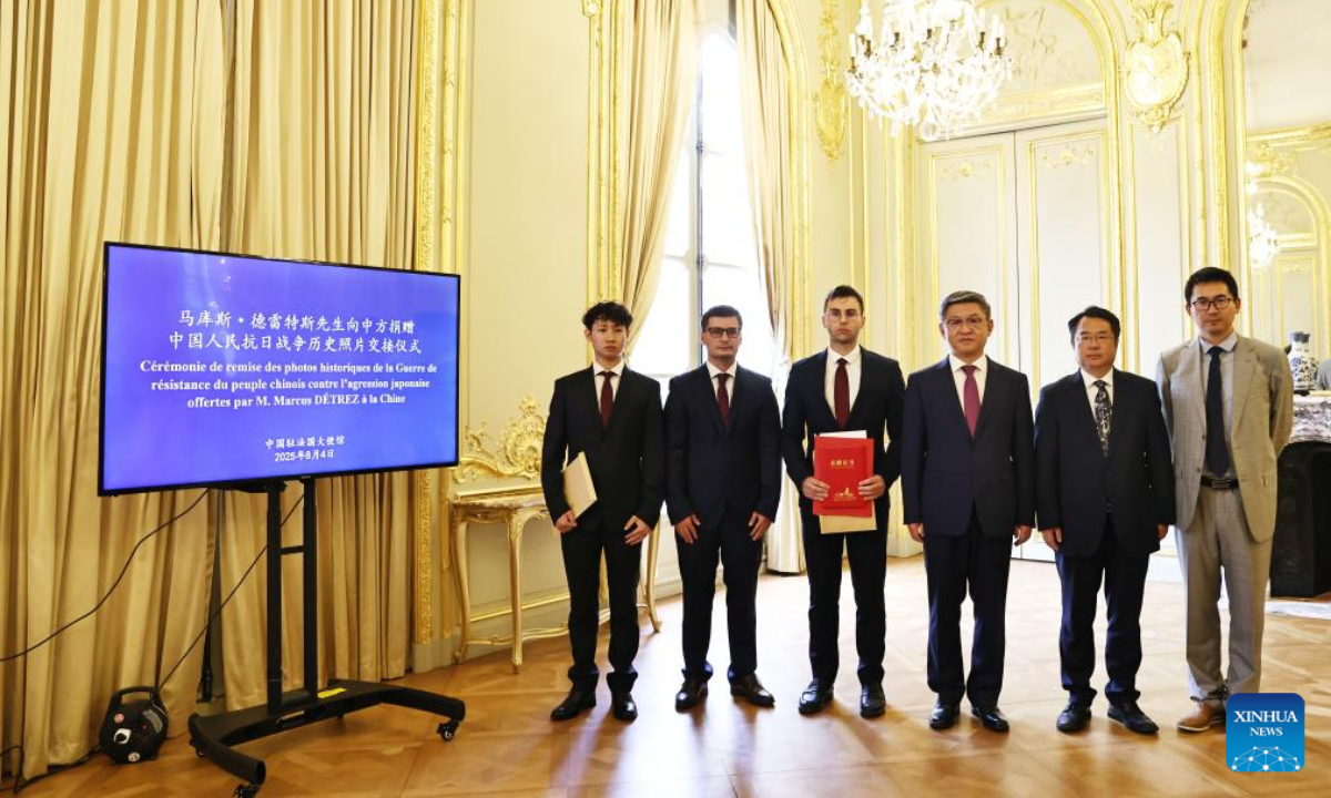 This photo taken on Aug 4, 2025 shows a ceremony for the handover of historical photos taken during the Chinese People's War of Resistance against Japanese Aggression, donated by Marcus Detrez (3rd L), at the Chinese Embassy in Paris, France, Aug 4, 2025. A ceremony for the handover of historical photos taken during the Chinese People's War of Resistance against Japanese Aggression, donated by Marcus Detrez, was held at the Chinese Embassy in France on Monday evening.
During the event, Chen Dong, minister at the Chinese Embassy in France, presented a donation certificate and a letter of thanks from the Shanghai Songhu Memorial Hall for the War of Resistance Against Japanese Aggression to Detrez, who had donated 618 historical photographs collected by his grandfather, Roger-Pierre Laurens. (Xinhua/Gao Jing)