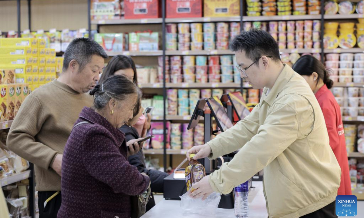 Tourists shop at a grocery store in the Yundu service area of the Huajiang Grand Canyon Bridge in southwest China's Guizhou Province, Nov. 6, 2025. The Huajiang Grand Canyon Bridge, soaring 625 meters above the Beipan River in Guizhou's mountainous terrain, is the world's highest bridge. The nearby Yundu service area features a comprehensive complex that integrates bridge viewing, sports experiences and other tourism services. (Xinhua/Ou Dongqu)